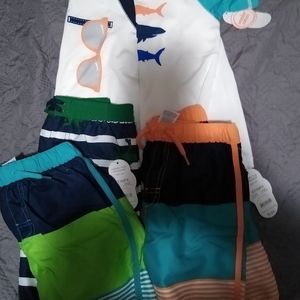 Boys three 4T swim shorts and two 5T swim shirts